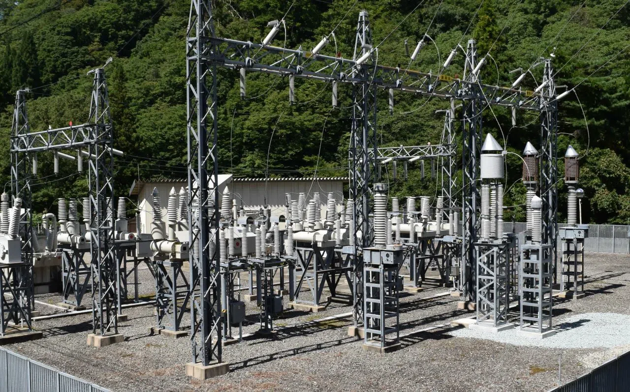 Substation in a remote area with green trees